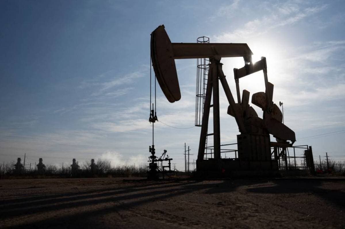 Oil barrels and crude price data representing gains in global energy markets amid Middle East supply concerns.