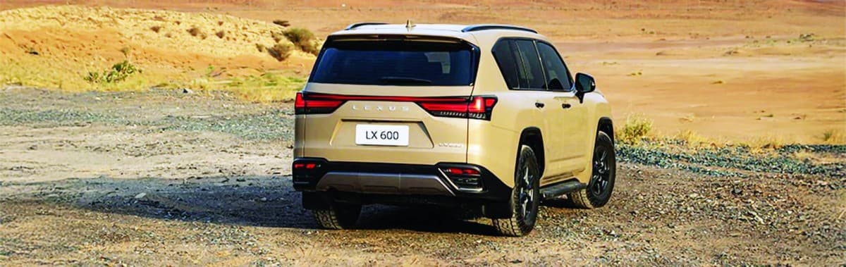 The Lexus LX600 Overtrail SUV, featuring a matte black grille, dark exterior trim, and off-road-spec 18-inch wheels.
