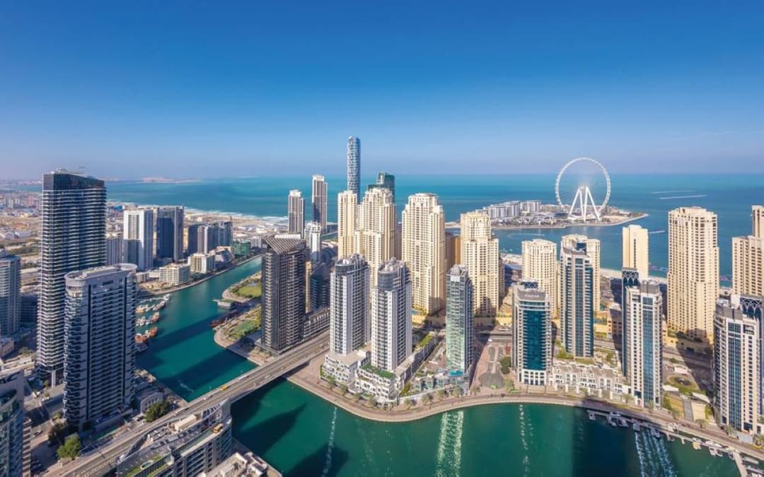 Aerial view of Dubai's residential apartment towers and waterfront developments reflecting the city's booming real estate market.