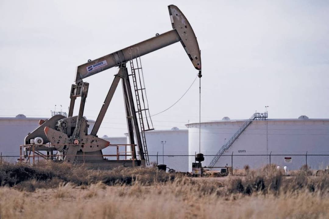 Oil price ticker board showing declining crude prices amid Middle East geopolitical tensions.