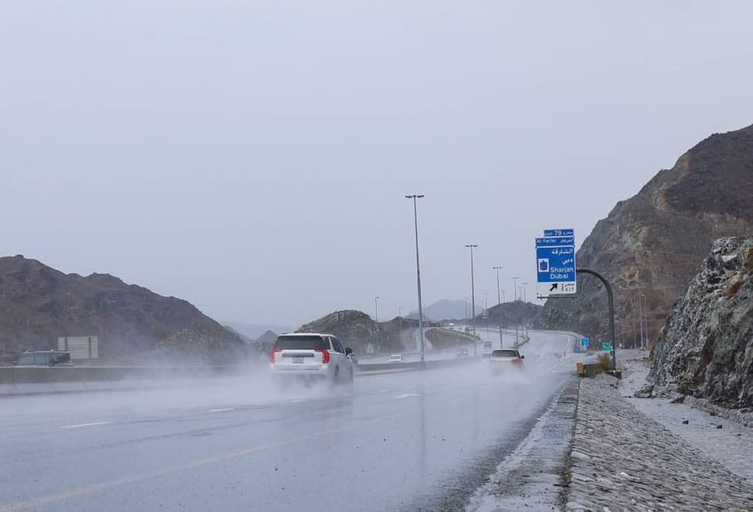 Rain clouds over the mountains surrounding Fujairah and Khor Fakkan during the summer Rawayeh rainfall.