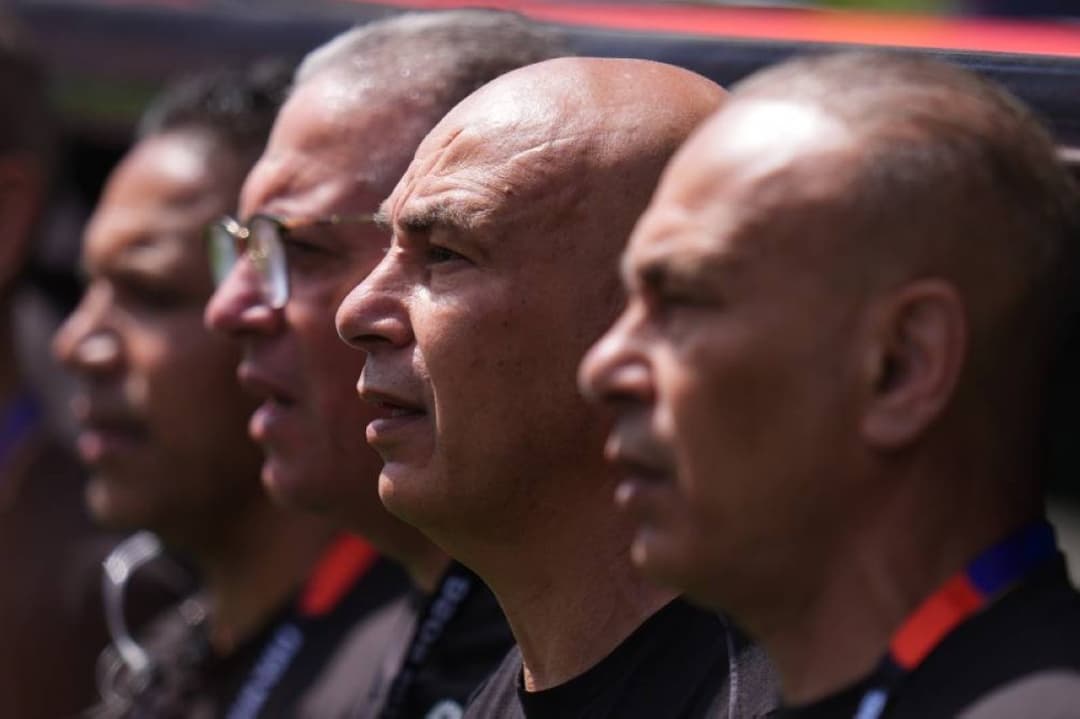 Hossam Hassan and Ibrahim Hassan stand together on the sideline in their roles as Egypt national team head coach and team director at the 2026 World Cup.