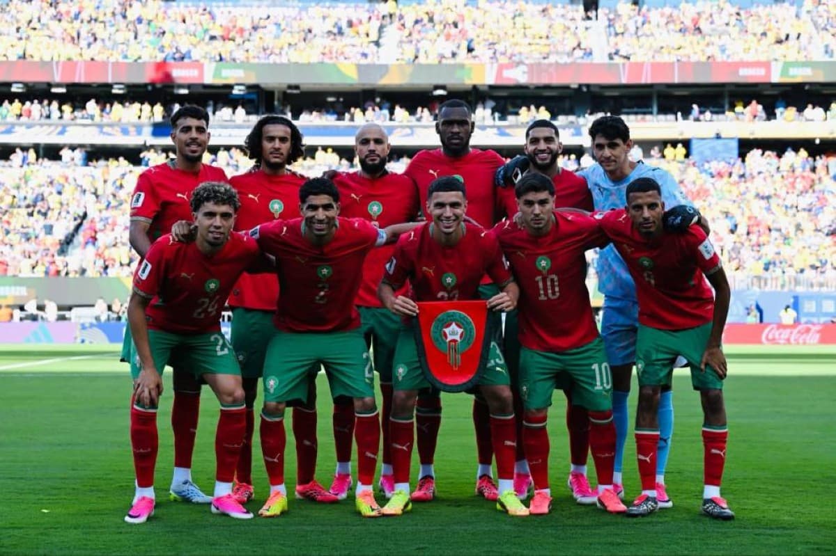 Morocco national football team celebrating after achieving their best-ever sixth-place FIFA world ranking during the 2026 World Cup.