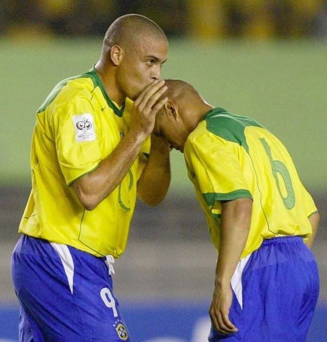 Ronaldo Nazário kisses Roberto Carlos on the head during Brazil's 3-1 win over Argentina at the Mineirão stadium in June 2004.