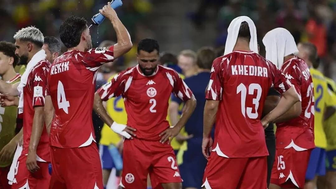 Players pause during a World Cup match to take a mandatory water break amid high temperatures.