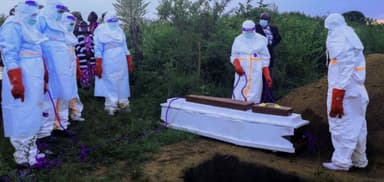 Healthcare workers in protective gear responding to the Ebola virus outbreak in the Democratic Republic of Congo.