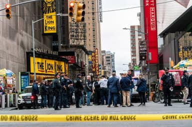 A view of Times Square in New York City following a shooting incident that prompted a security response and panic among pedestrians.
