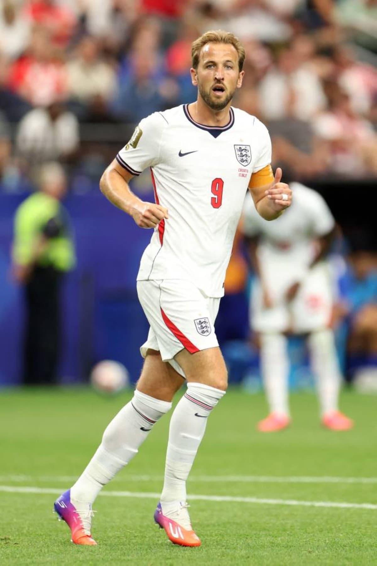 Harry Kane celebrating with England fans after the team's 4-2 World Cup victory over Croatia.