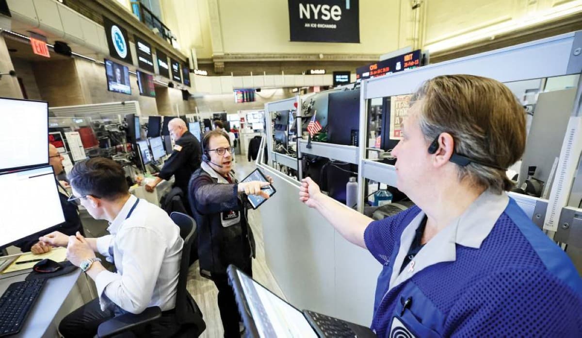 A stock market trading board displaying green gains across global equity indices amid a geopolitical ceasefire announcement.