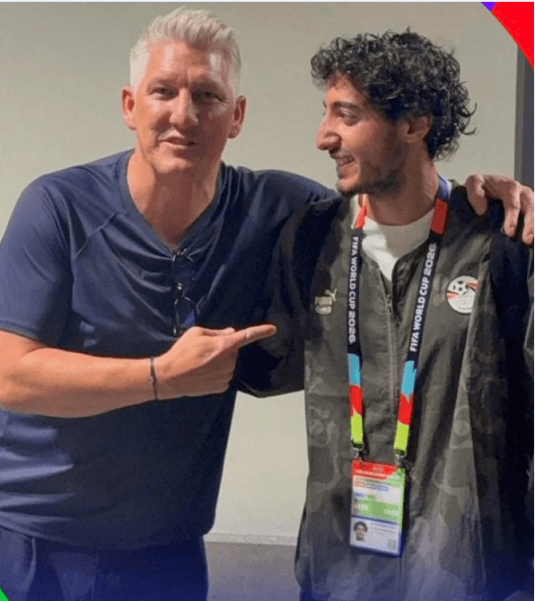 Mohamed Hani, Egypt's right back, poses for a commemorative photo with German football legend Bastian Schweinsteiger following Egypt's 1-1 draw with Belgium at the 2026 FIFA World Cup.