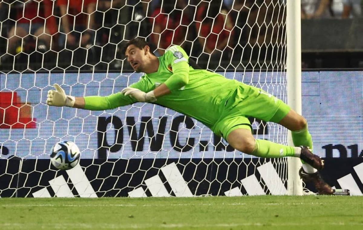 Thibaut Courtois in action as Belgium's goalkeeper during the 2026 World Cup group stage match against Iran.