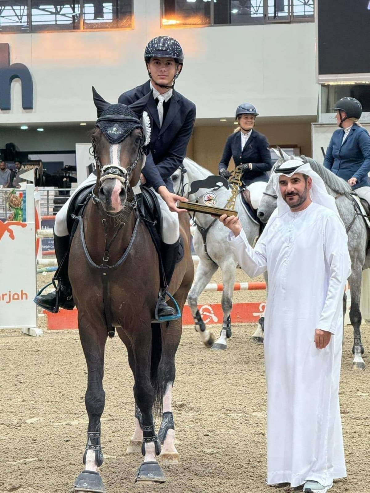 Riders competing in the 1.30m show jumping competition at the Sharjah Equestrian Centre indoor arena during the second summer week.