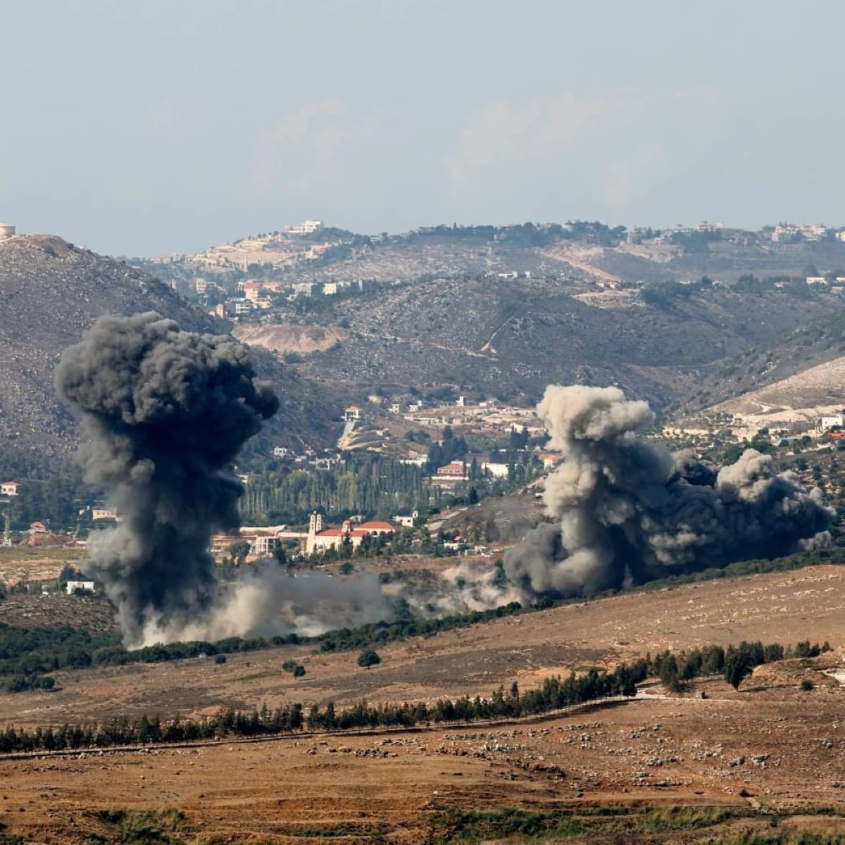 Smoke rises over the town of Kfar Tibnit in southern Lebanon following Israeli artillery shelling.