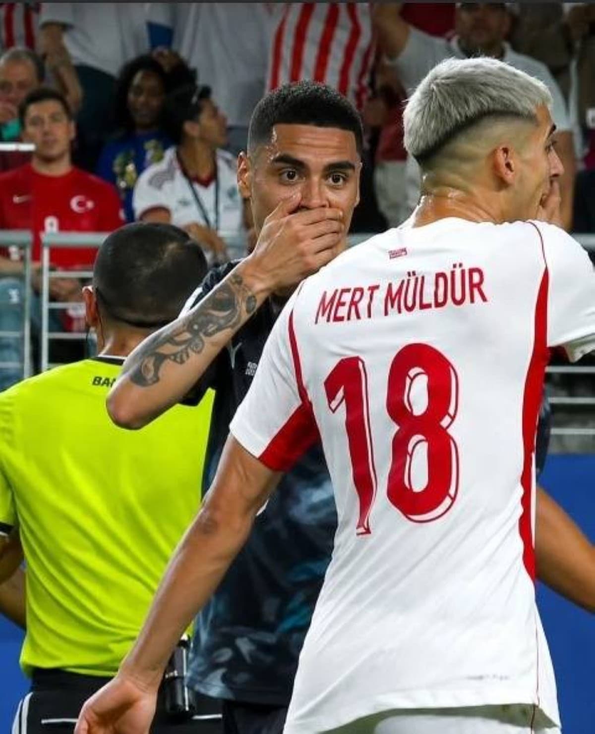 Paraguay's Miguel Almiron covers his mouth during a verbal confrontation in the 2026 World Cup match against Turkey, the incident that led to the first-ever red card for a communication-prohibition gesture in World Cup history.