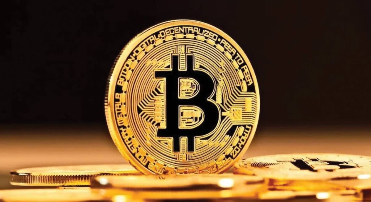 A digital display showing falling cryptocurrency prices including Bitcoin and Ethereum amid a global market sell-off.