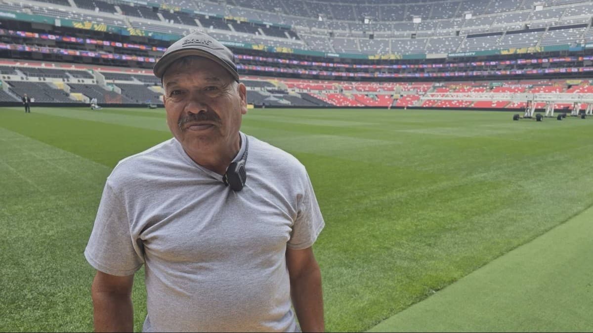 Isabel 'Chapillo' Ramirez, the veteran groundsman of Estadio Azteca in Mexico City, standing on the famous pitch he has maintained for over four decades.