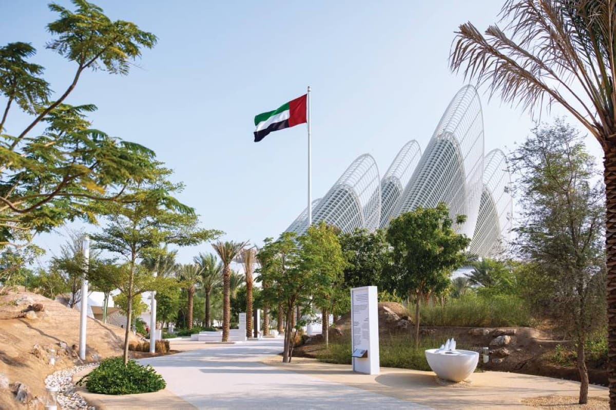 Emirati researcher Latifa Sahou Al Suwaidi with a copy of the UAE Museums Guide, a national reference documenting the country's government museum collections and cultural heritage.