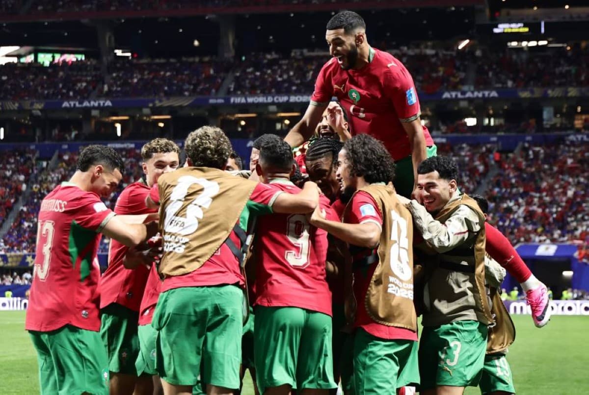 Morocco players celebrate after qualifying for the round of 32 at the 2026 FIFA World Cup following their 4-2 victory over Haiti.