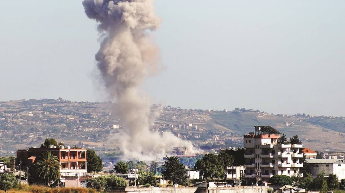 Destruction in southern Lebanon following Israeli air strikes, with damaged buildings visible amid the aftermath of the attacks.