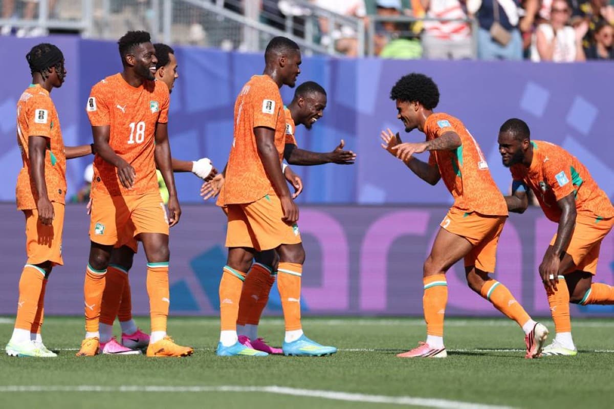 African national team players celebrate on the pitch during the 2026 World Cup group stage.
