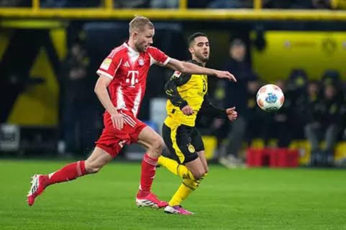 A Bundesliga match in progress, illustrating the professional football environment where new FIFA rule changes will be implemented from July 2025.