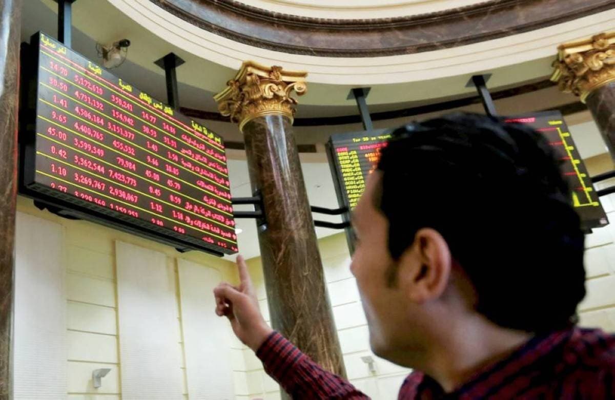 A digital trading board displaying falling stock market indices across Arab financial markets.