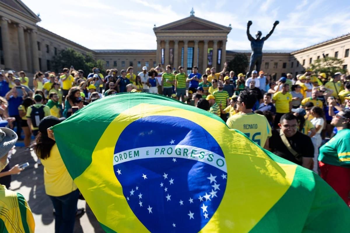 Empty seats visible inside a 2026 FIFA World Cup stadium during a group-stage match, contrasting with large crowds gathered outside the venue.