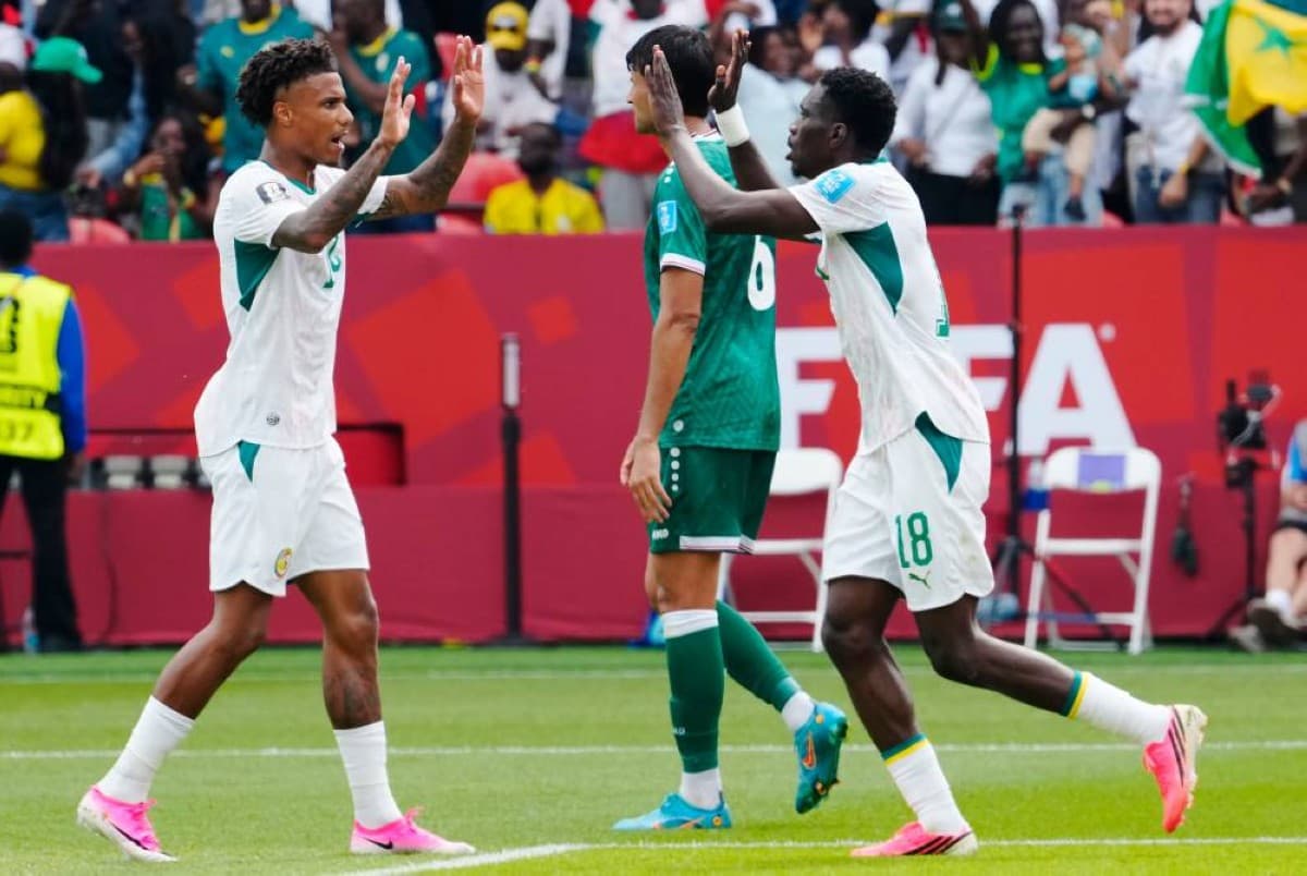 Senegal players celebrating a goal against Iraq during their decisive World Cup 2026 qualifying match.