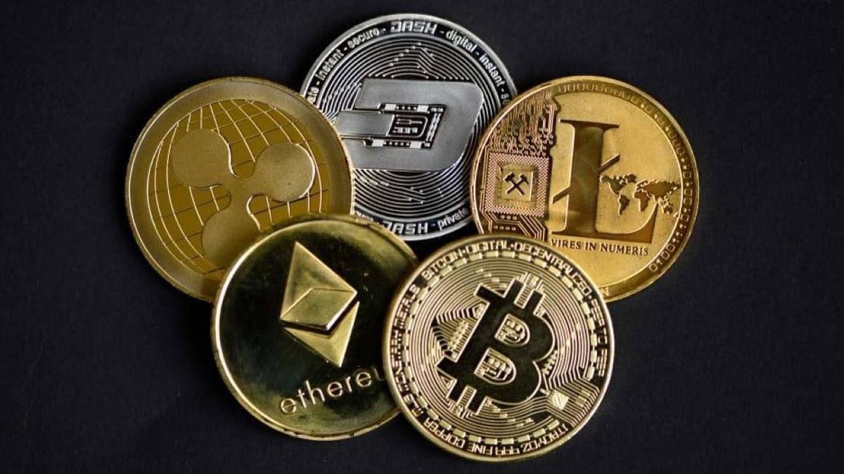 A digital display showing cryptocurrency price movements with red declining charts reflecting the broad weekly selloff across major digital assets.