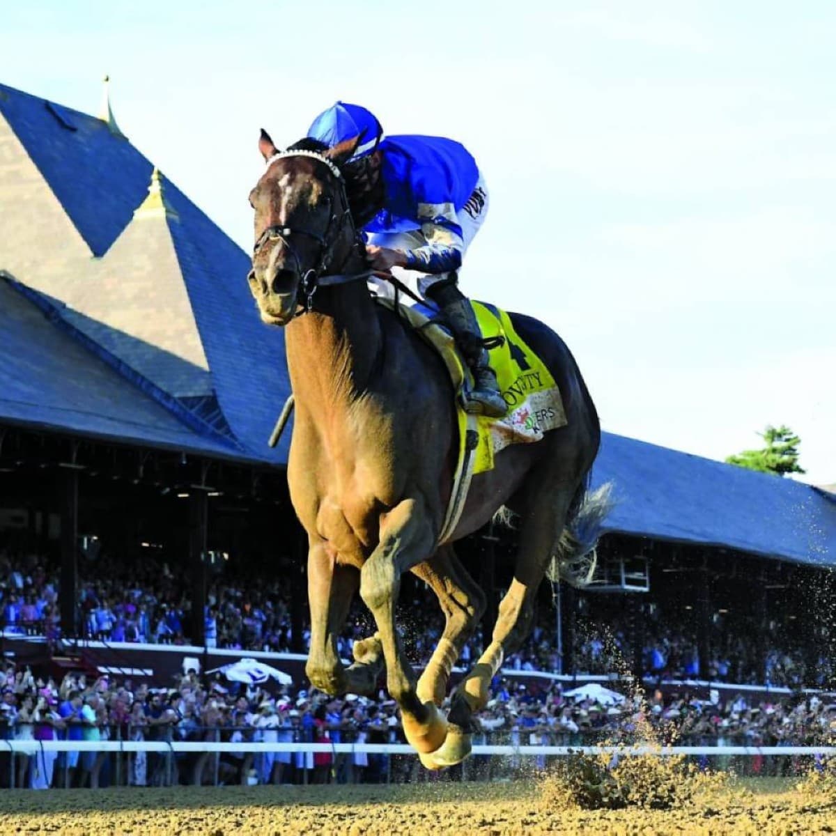 Sovereignty, wearing Godolphin's royal blue silks, gallops on the track at Churchill Downs racecourse.