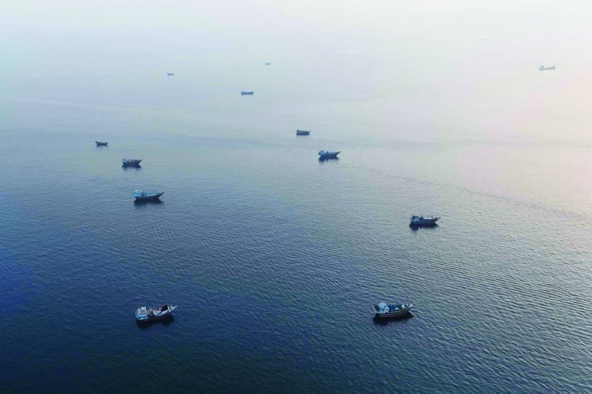 A military or naval scene in the Strait of Hormuz region illustrating the exchange of strikes between US and Iranian forces.