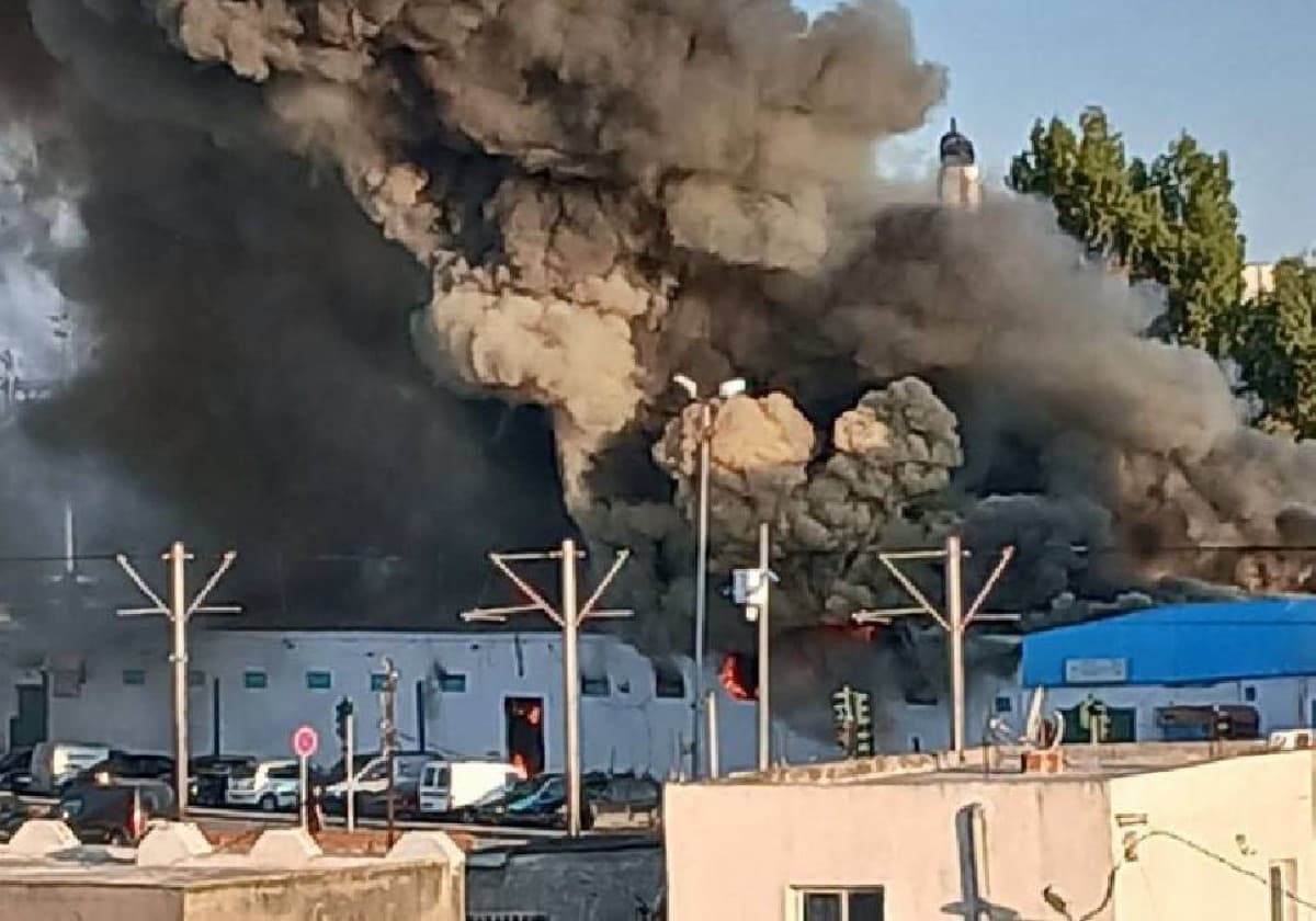 Thick black smoke billows above the Sidi Abdel Salam market in the Bab Saadoun area of central Tunis as firefighters work to contain the blaze.