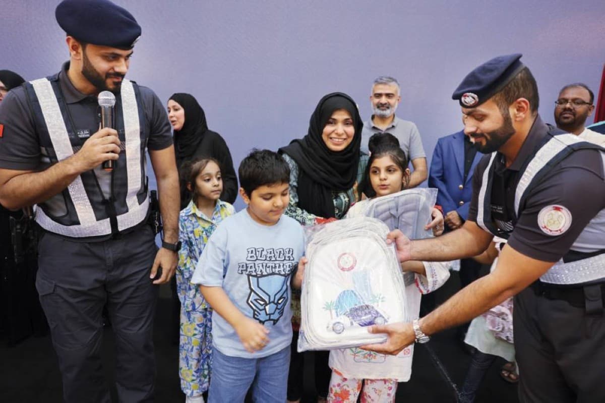 Abu Dhabi Police officers at a community traffic awareness event for Asian communities at Abu Dhabi Sports Club.