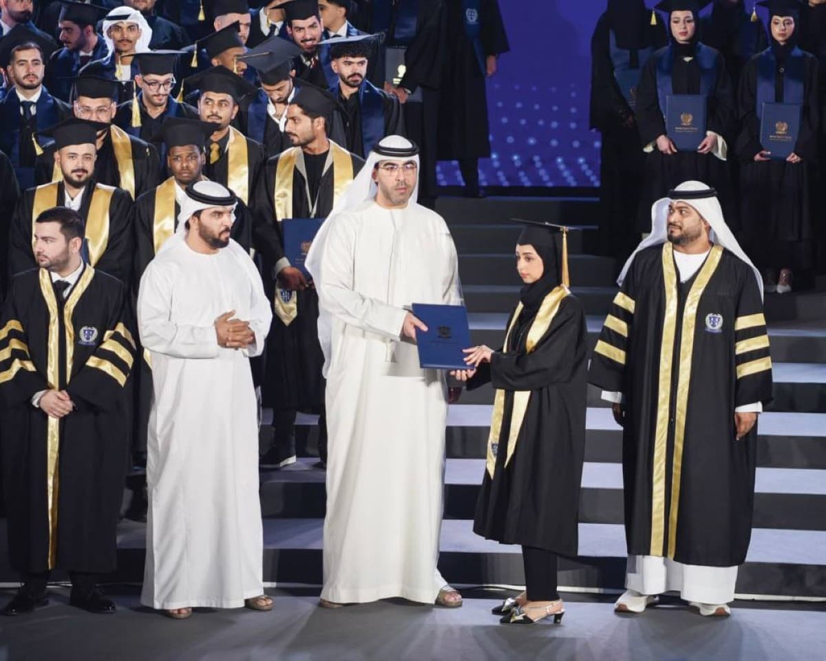 Sheikh Ahmed bin Saud bin Rashid Al Mualla presenting graduation awards to students of the 'Pride and Eminence' cohort at the British Applied College ceremony in Umm Al Quwain.