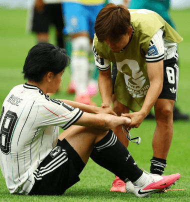 Japan players look dejected after their 1-2 World Cup round-of-32 defeat to Brazil in the 2026 tournament.
