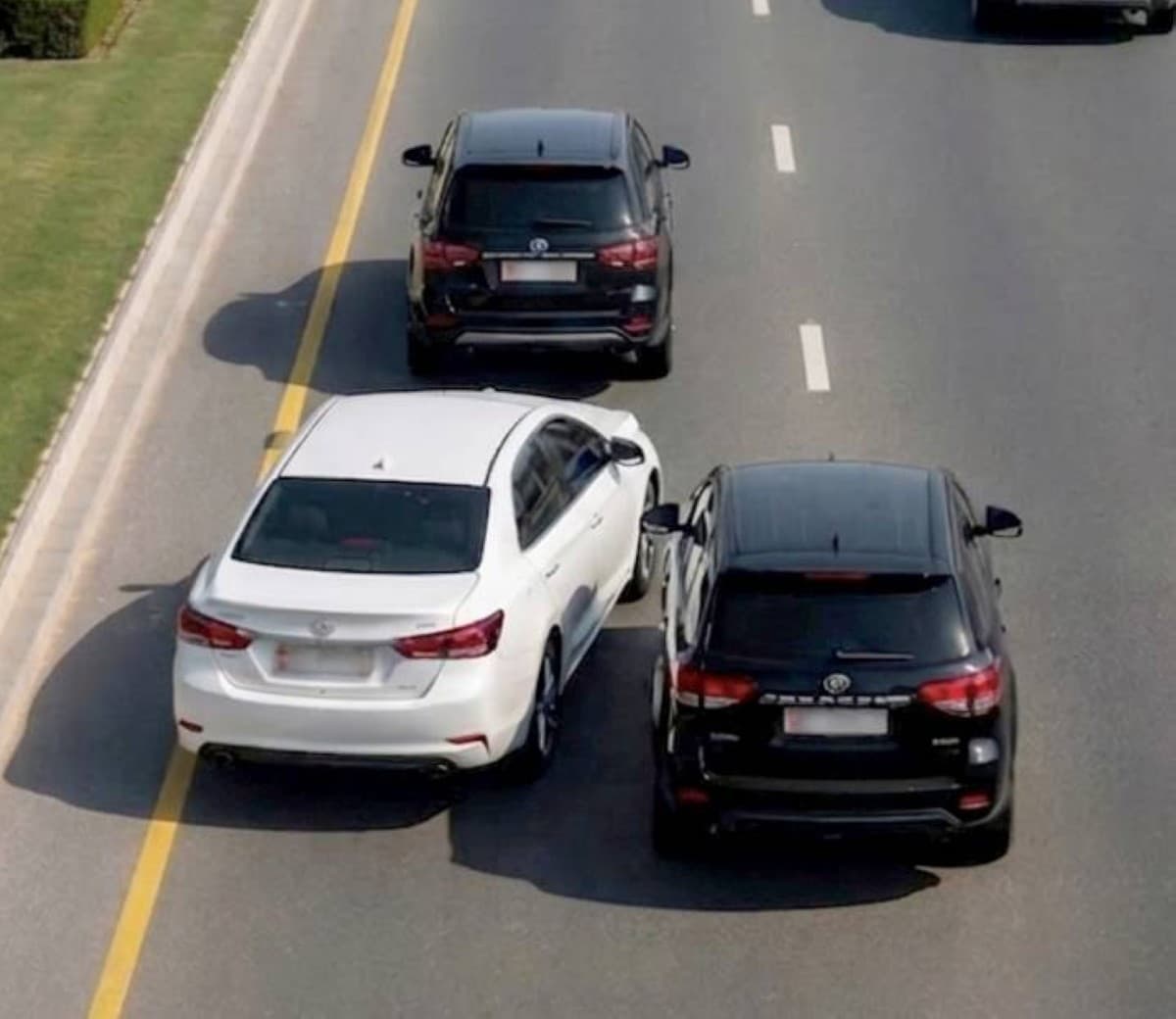A vehicle on a public road in Abu Dhabi, illustrating a reckless driving case that resulted in a criminal conviction.