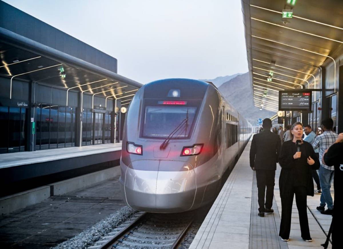 .As the first journey's whistle sounded in sync with sunrise, the train departed Fujairah station at 5:34 a.m. amid feelings of joy and anticipation, heading to Mohamed bin Zayed City station in Abu Dhabi.During the journey, passengers enjoyed a comprehensive modern travel experience that included comfortable seats, wireless internet service, charging ports for electronic devices at every seat, as well as dedicated luggage spaces and business-class services designed to provide the highest levels of comfort and luxury.Hamad Mansour Al Blooshi expressed his immense happiness at participating in this historic moment, affirming that being chosen as the first passenger aboard Etihad Rail is a great source of pride and honour for him.Athra Al Mansoori, Executive Director of the Commercial Sector at Etihad Rail Passenger Services, confirmed in statements to Al Bayan that 30 June is a historic milestone in the national transport journey.She noted that the departure of the first passenger train at sunrise from Fujairah to Abu Dhabi embodies the UAE's ambitions towards a more connected and sustainable future.She added that travellers enjoy a unique opportunity during the journey to take in the stunning natural scenery along the route, noting that passengers will benefit during the first week from a complimentary menu with an Emirati flavour, prepared by national hands.In Abu Dhabi, Mohamed bin Zayed City station witnessed another historic moment as the first passenger train arrived amid a festive atmosphere filled with feelings of joy and pride. The train was received by a number of officials, guests, and community members who joined in celebrating the occasion.Emirati heritage arts also lent an authentic celebratory character to the reception ceremony, as folk performances and traditional songs blended with feelings of pride.A sophisticated ticketing section was designated, relying on a modern technological system that reduced the time to purchase and receive a ticket to just 15 seconds, contributing to expediting travel procedures and ensuring passengers reach the train easily and on time.Etihad Rail also announced its cooperation with the Integrated Transport Centre