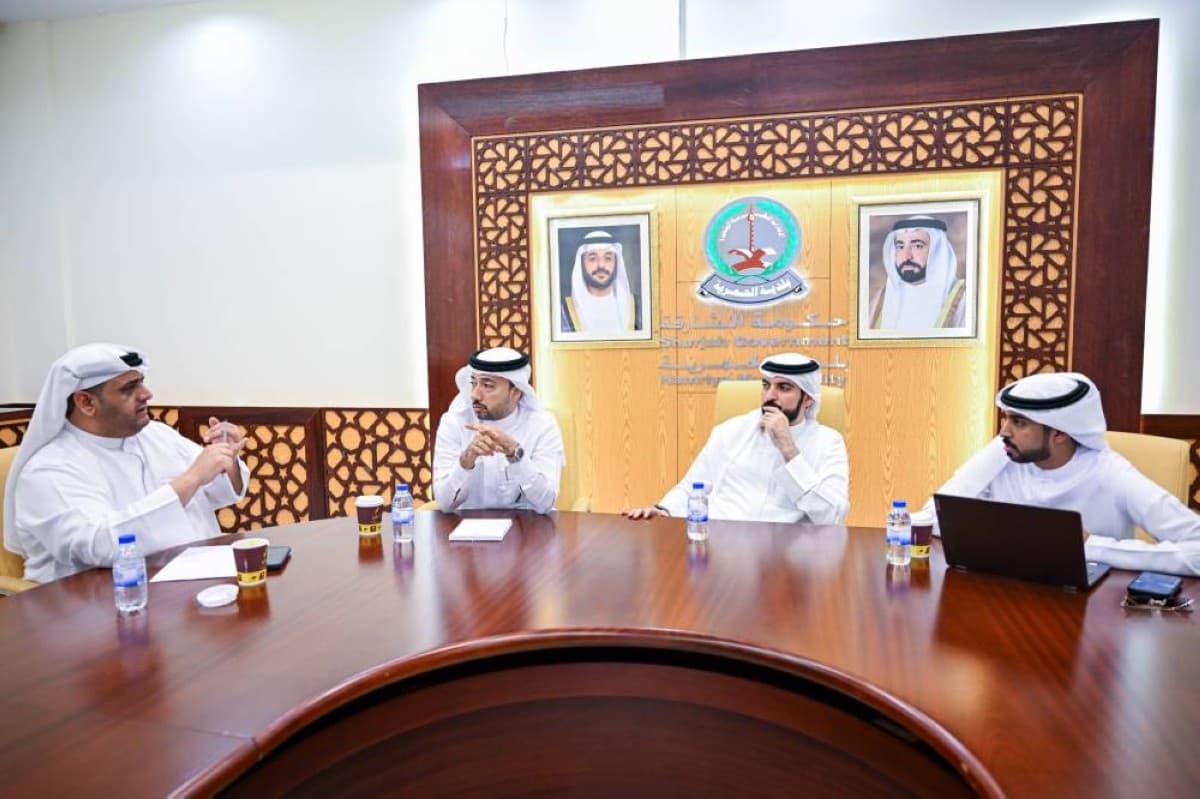 Al Hamriyah City Municipality officials meeting with Al Hamriyah Cultural Sports Club representatives to coordinate the 'Our Holiday is Different 2026' summer programme.
