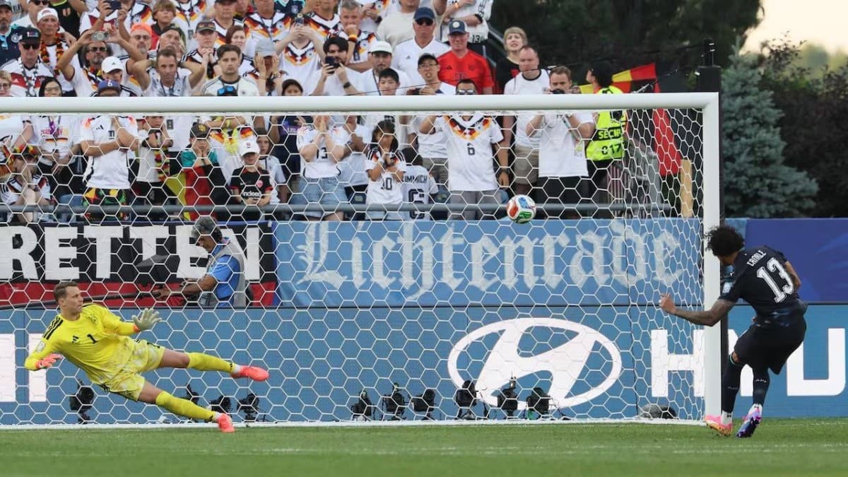 A player steps up to take a penalty kick during a 2026 World Cup knockout match as the goalkeeper watches from the goal line.