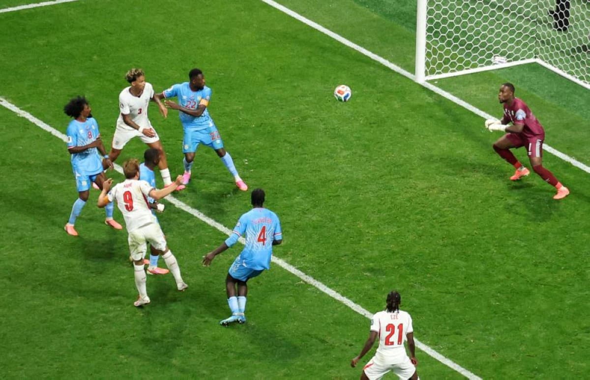England players celebrate after scoring against the Democratic Republic of Congo in their World Cup round of 32 match.