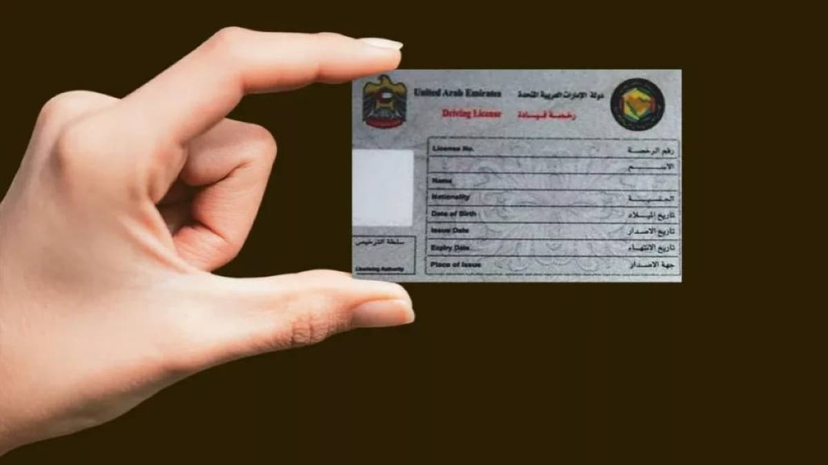 A UAE driving licence alongside a passport, representing international recognition of the UAE licence for travel and residency abroad.