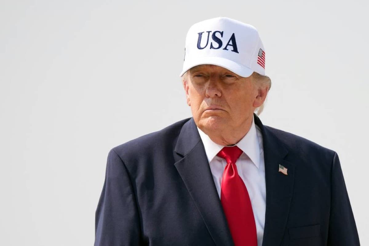 US President Donald Trump speaking at a podium, illustrating a report about his financial disclosures showing $2.2 billion in earnings during his first year back in the White House.