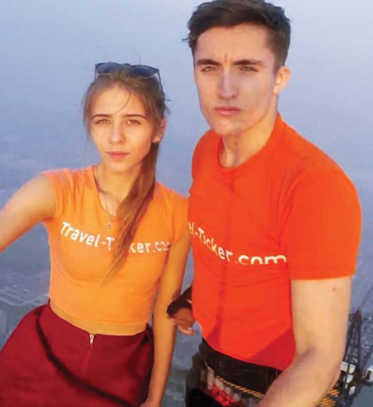 Ivan Kuznetsov and Angelina Nikolau posing at the top of the Empire State Building in New York after climbing to its 443-metre summit.