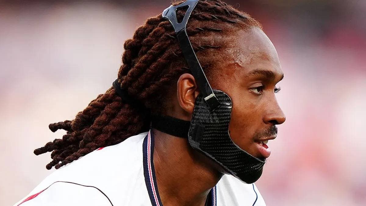 Austria defender Stefan Posch wearing a black jaw brace during a 2026 FIFA World Cup match.
