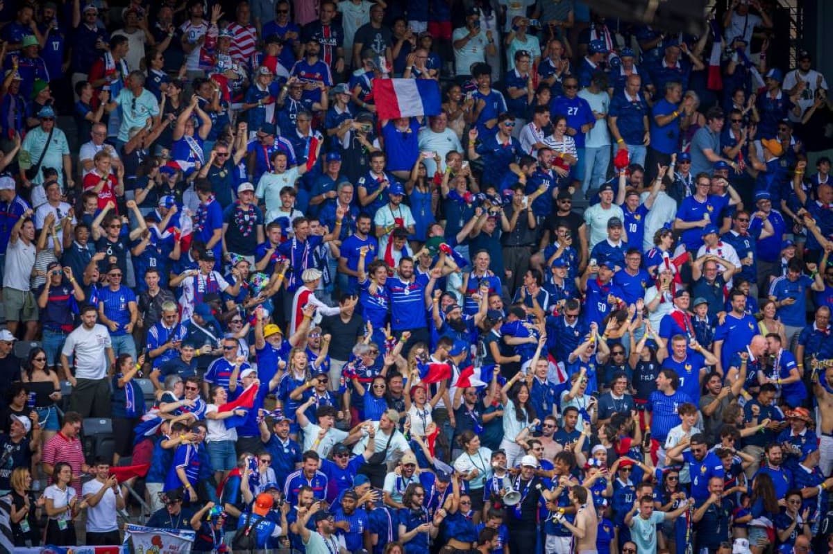 Fans gathered outside a stadium in Philadelphia under bright sunshine ahead of the France vs Paraguay 2026 World Cup round-of-16 match.
