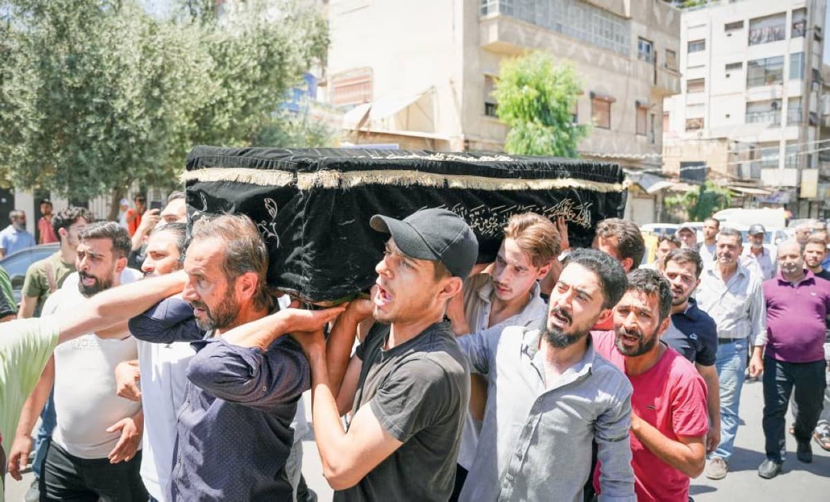 Emergency responders and security personnel at the scene of the terrorist bombing near the Palace of Justice in central Damascus.