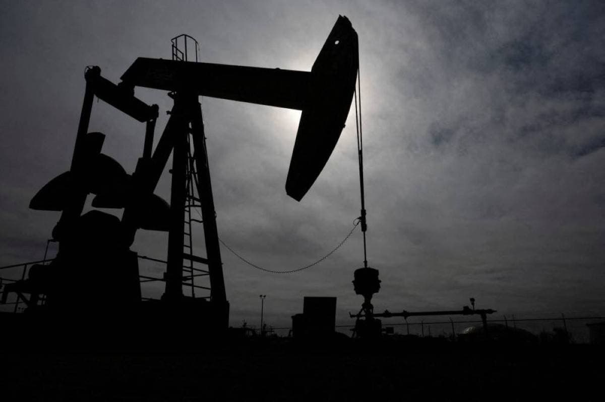 Oil storage tanks and infrastructure representing global crude oil markets amid US-Iran diplomatic developments.