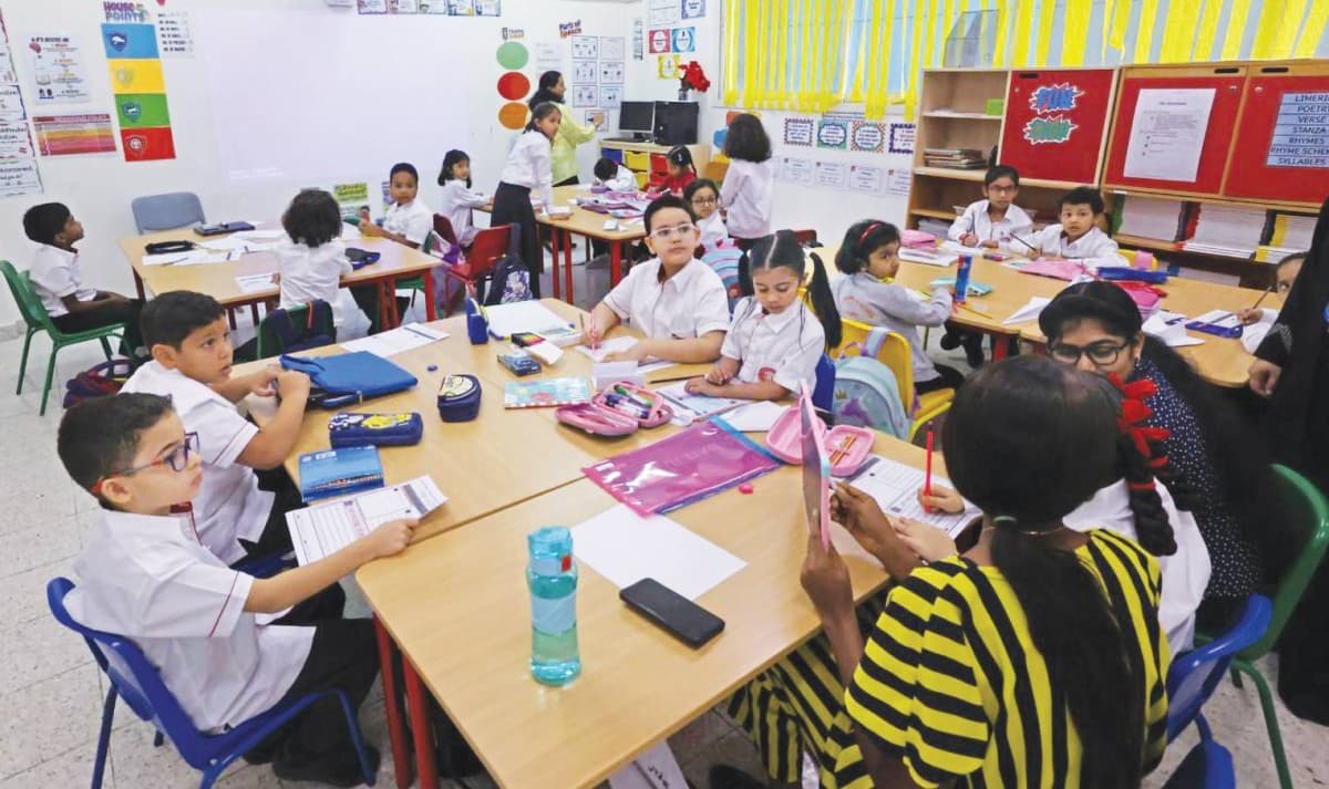 Students engaged in a collaborative classroom activity at a Dubai school, reflecting the shift towards skills-based learning under the new 'Skills for Life' framework.