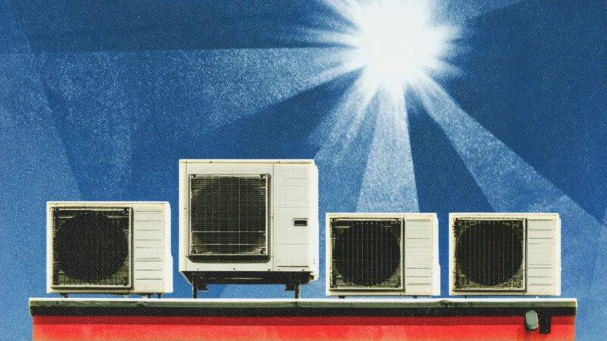A residential building in a European city with air conditioning units mounted on its exterior façade during a summer heat wave.