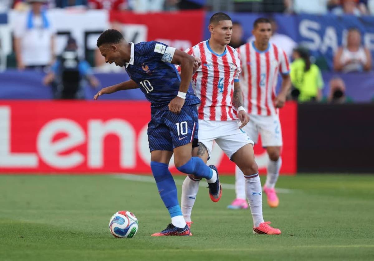 France players celebrate after scoring a decisive penalty against Paraguay in their World Cup 2026 qualifier.